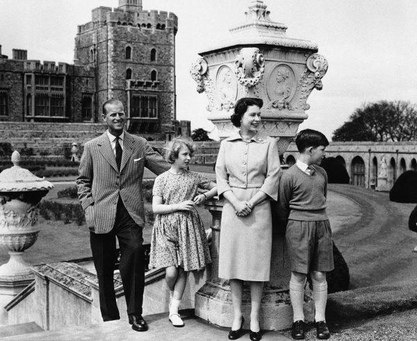 Britain's first family Prince Philip, Princess Anne, Queen Elizabeth II, and Prince Charles, stand in the East Terrace Garden at Windsor Castle in England on June 5, 1959. (AP Photo)