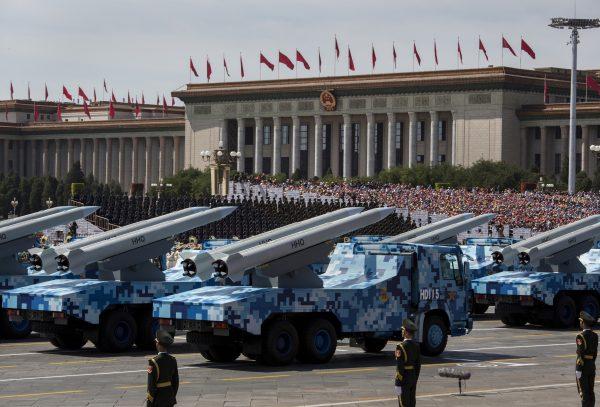 Chinese missiles are seen on trucks as they drive next to Tiananmen Square and the Great Hall of the People during a military parade in Beijing, China on Sept. 3, 2015. (Kevin Frayer/Getty Images)