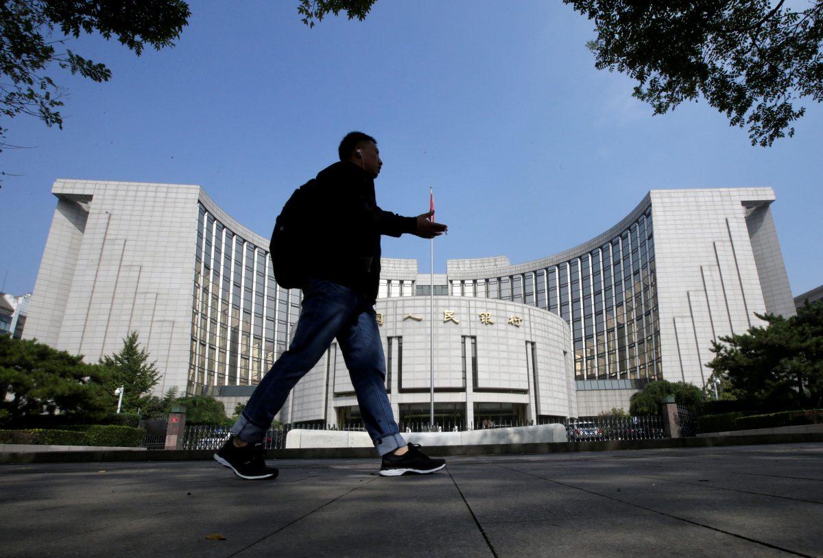 A man walks past the headquarters of the People’s Bank of China (PBOC), the central bank, in Beijing on Sept. 28, 2018. (Jason Lee/Reuters)