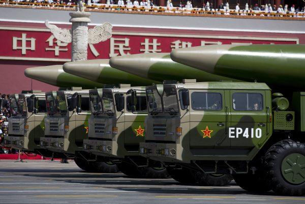 Military vehicles carrying DF-26 ballistic missiles drive past the Tiananmen Gate during a military parade in Beijing on Sept. 3, 2015. (Andy Wong - Pool /Getty Images)