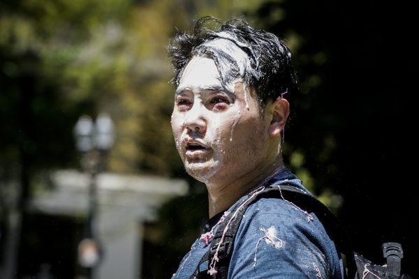 Andy Ngo, a Portland-based journalist, is seen covered in an unknown substance after Antifa extremists assaulted him in Portland, Oregon, on June 29, 2019. (Moriah Ratner/Getty Images)