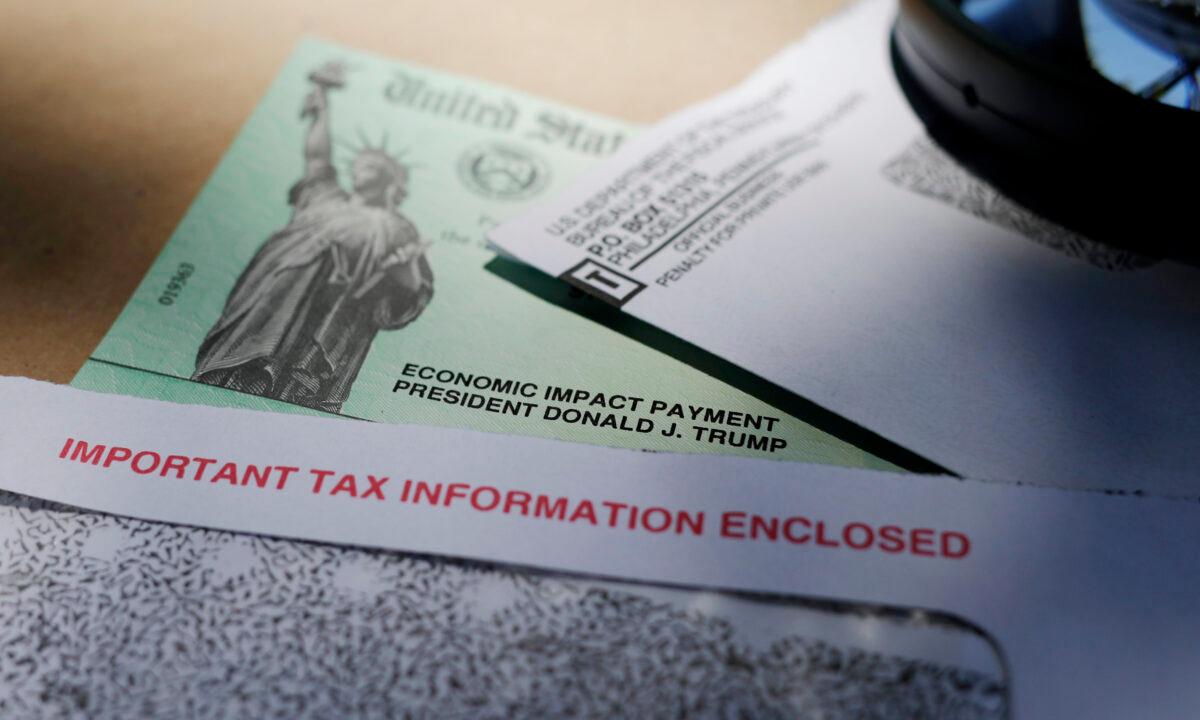 President Donald Trump's name is seen on a stimulus check issued by the IRS to help combat the adverse economic effects of the COVID-19 outbreak, in San Antonio on April 23, 2020. (Eric Gay/AP Photo)