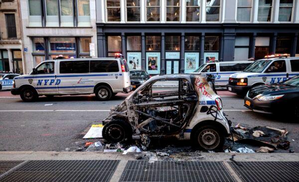 A destroyed NYPD police car is seen after a night of protest in Lower Manhattan in New York City on June 1, 2020. (Johannes Eisele/AFP via Getty Images)