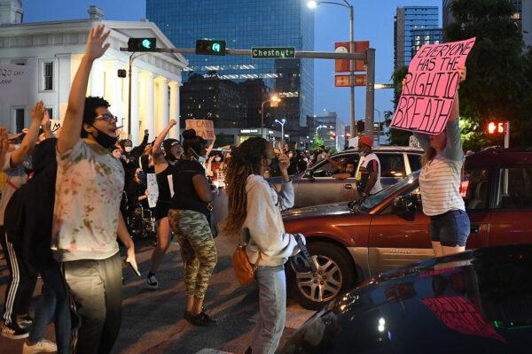 Protesters rally as they march through the streets in St Louis, Missouri on May 29, 2020. (Michael B. Thomas/Getty Images)