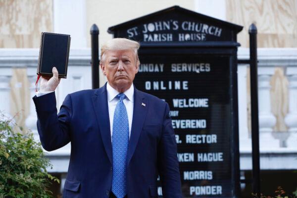 President Donald Trump holds a Bible as he visits outside St. John's Church across Lafayette Park from the White House, in Washington on June 1, 2020. (Patrick Semansky/AP Photo)