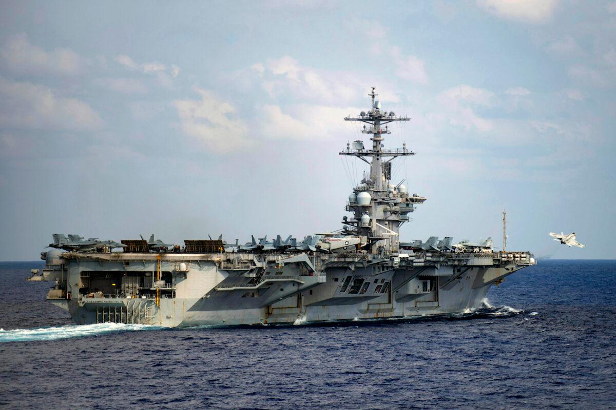 Aircraft carrier USS Theodore Roosevelt in the western North Pacific Ocean, on March 18, 2020. (Mass Communication Specialist 3rd Class Nicholas V. Huynh/U.S. Navy via AP)
