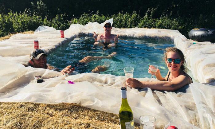 Family Build Makeshift Swimming Pool Out of Hay Bales in Backyard During Heatwave