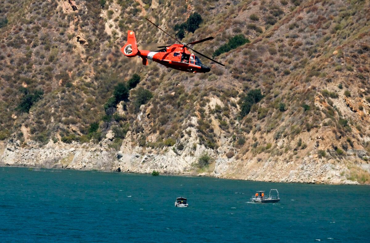 A helicopter helps in the search for former "Glee" star Naya Rivera at Lake Piru in Los Padres National Forest, northwest of Los Angeles, Calif., on July 9, 2020. (Ringo H.W. Chiu/AP Photo)