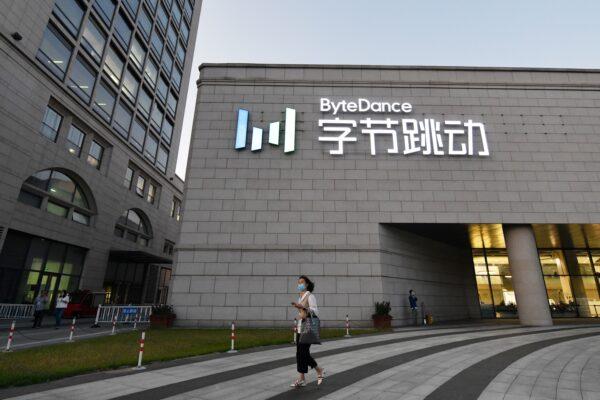 A woman walks past the headquarters of ByteDance, the parent company of video-sharing app TikTok, in Beijing on Sept. 16, 2020. (Greg Baker/AFP via Getty Images)