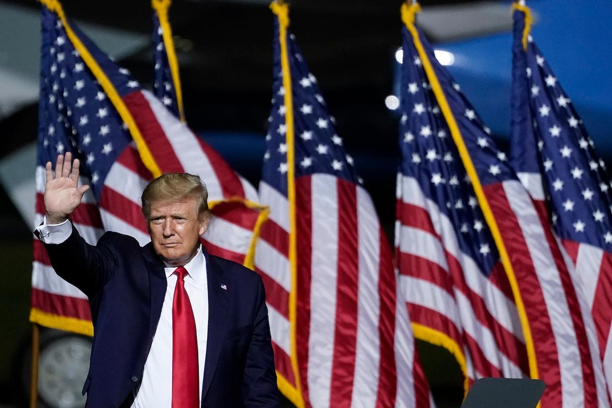 President Donald Trump waves as he concludes his remarks during a campaign rally at Newport News/Williamsburg International Airport in Newport News, Va., on Sept. 25, 2020. (Drew Angerer/Getty Images)