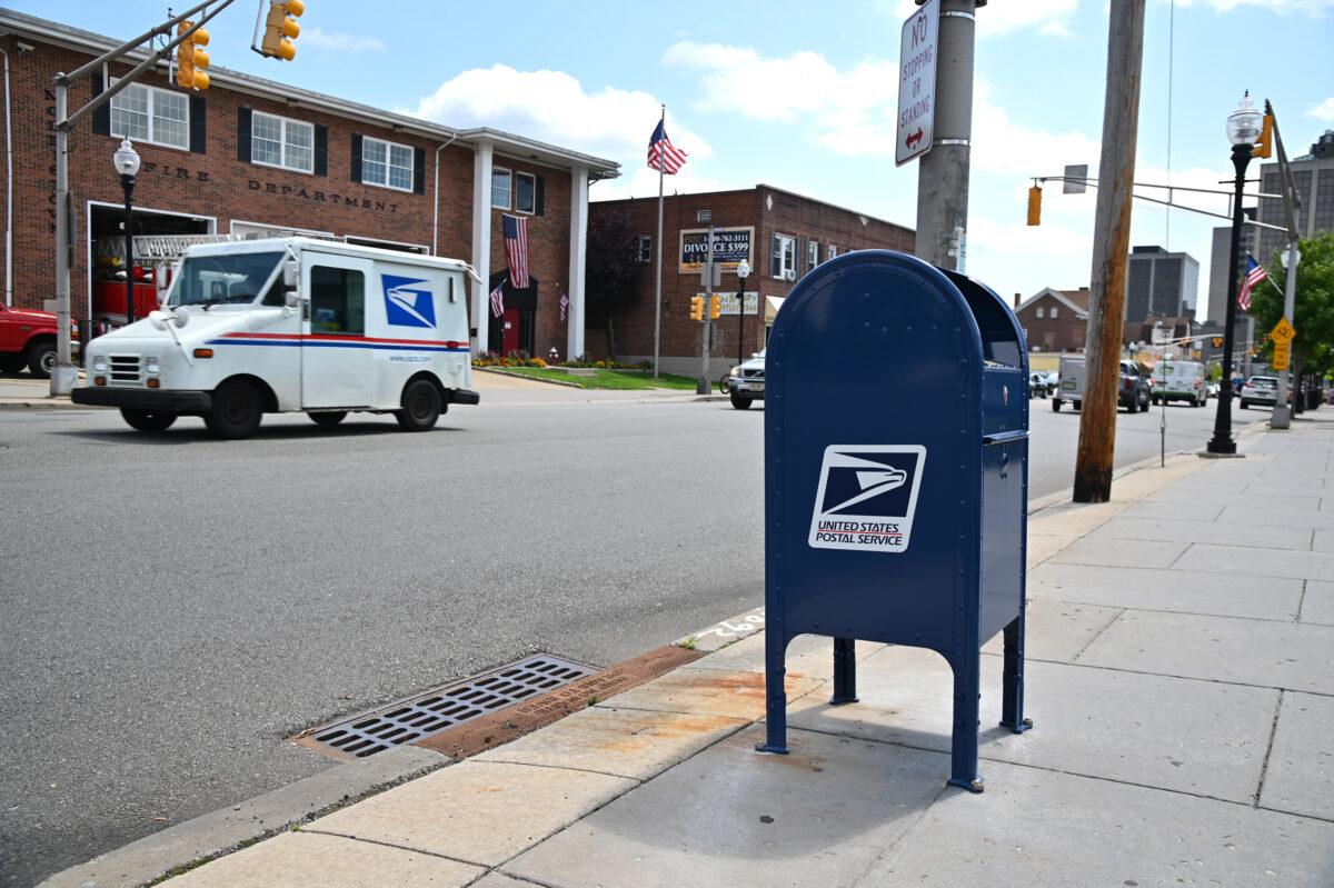 Cars drive past a mailbox in Morristown, N.J, on Aug. 17, 2020. (Theo Wargo/Getty Images)