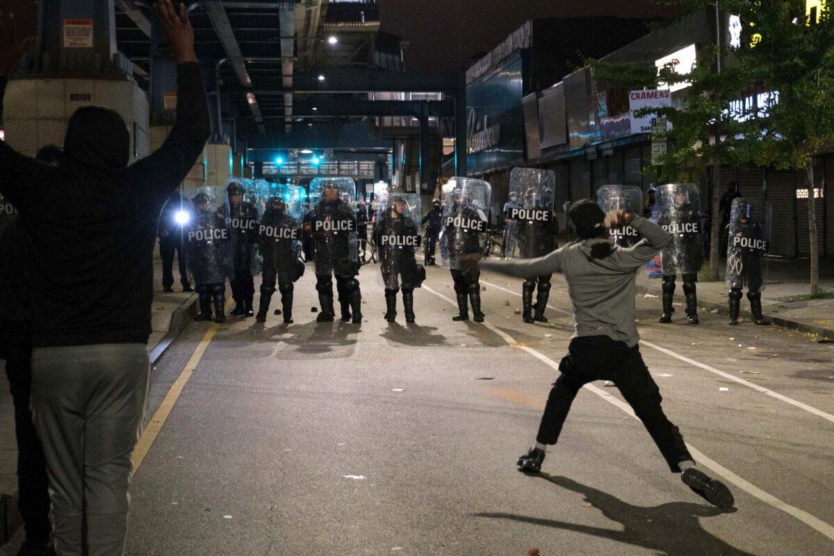 Rioters clash with police in Philadelphia, Penn., on Oct. 27, 2020. (Yuki Iwamura/Reuters)