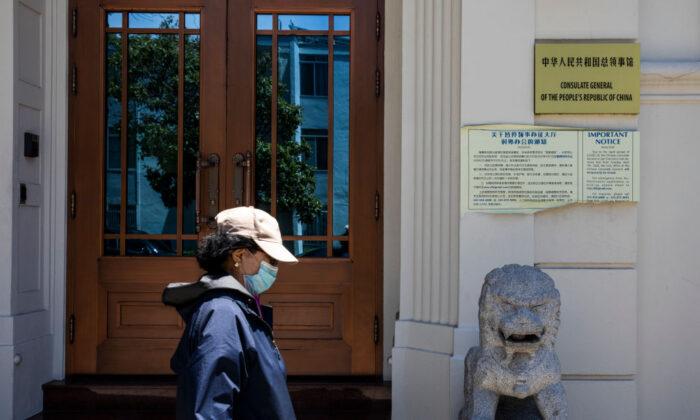 A woman walks past the Chinese Consulate in San Francisco, on July 23, 2020. (Philip Pacheco/AFP via Getty Images)