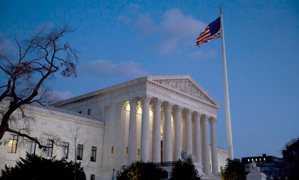 The American flag flies in front of the U.S. Supreme Court in Washington on Feb 13, 2016. (Drew Angerer/Getty Images)