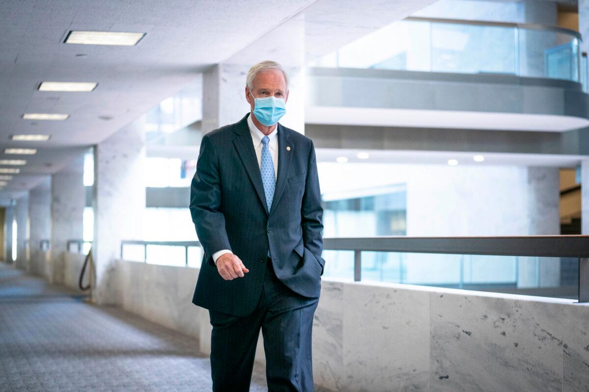 Sen. Ron Johnson (R-Wis.) walks to a Republican caucus luncheon in the Hart Senate Office Building in Washington on Oct. 23, 2020. (Sarah Silbiger/Getty Images)