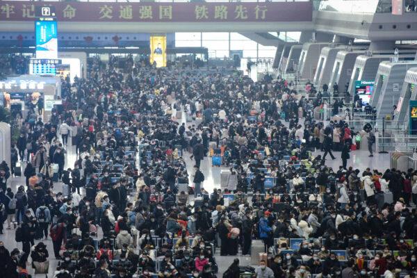 People wait to board trains at Hangzhou East Railway Station in Hangzhou, in eastern China's Zhejiang Province on Jan. 28, 2021. (STR/AFP via Getty Images)