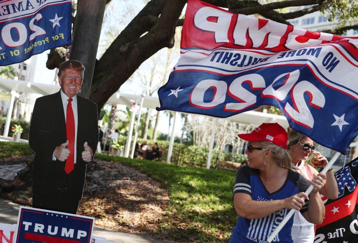 Supporters of former President Donald Trump stand outside of the Hyatt Regency where the Conservative Political Action Conference is being held in Orlando, Fla., on Feb. 28, 2021. (Joe Raedle/Getty Images)
