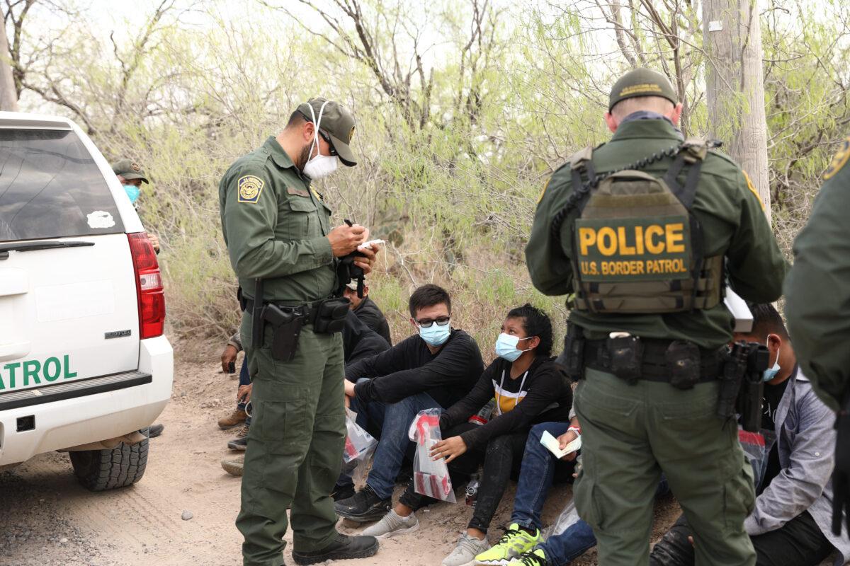 Border Patrol agents arrest seven illegal immigrants who tried to evade capture near Penitas, Texas, on March 15, 2021. (Charlotte Cuthbertson/The Epoch Times)