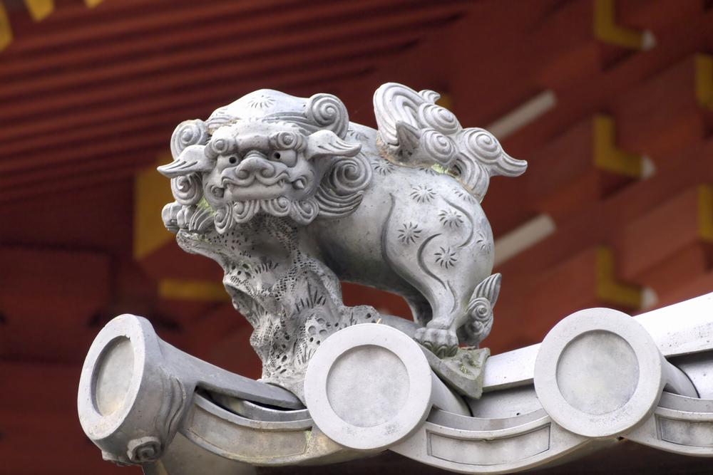 A komainu, known as a lion-dog, protects the temple and wards off evil. The komainu is similar to the Chinese guardian lion that originated in the Tang Dynasty. (Oleg Ivanenko/Shutterstock.com)