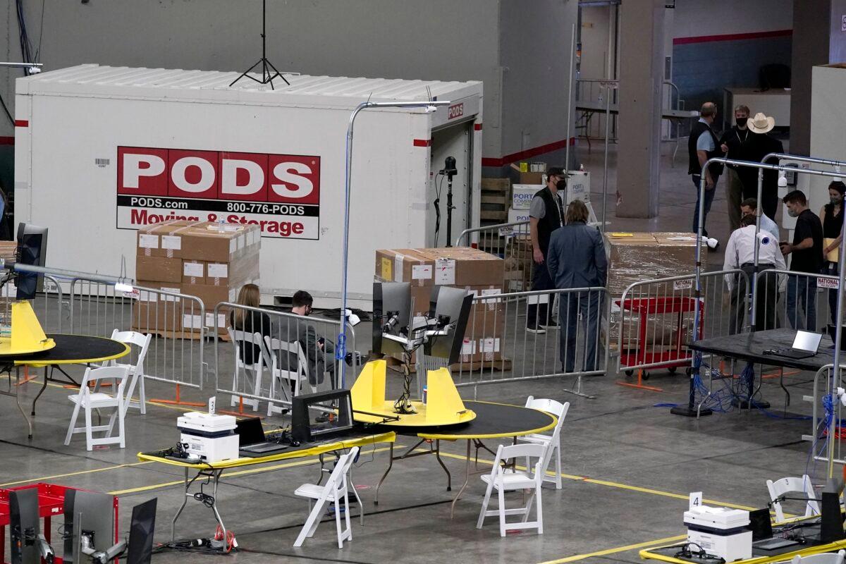 Some of the 2.1 million ballots cast during the 2020 election are brought in for an audit ordered by the Arizona Senate, at the Arizona Veterans Memorial Coliseum in Phoenix, on April 22, 2021. (Ross D. Franklin/AP Photo)