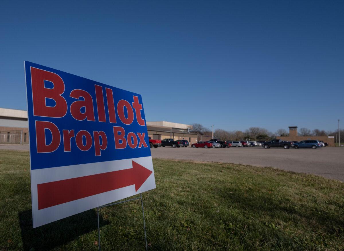 A sign pointing in the direction of a ballot drop box in Lansing, Mich., on Nov. 3, 2020. (Seth Herald/AFP via Getty Images)