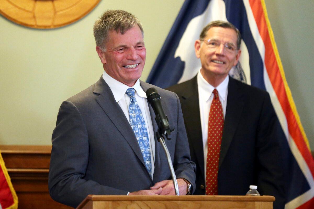 Wyoming Gov. Mark Gordon (L), shares a smile with Sen. John Barrasso (R-Wyo.) during the press conference in Cheyenne, Wyo., on June 2, 2021. (Michael Cummo/The Wyoming Tribune Eagle via AP)