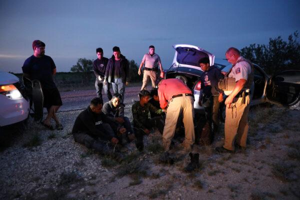 Kinney County Constable Steve Gallegos and Kinney County Sheriff’s deputies arrest a smuggler and seven illegal aliens from Guatemala near Brackettville, Texas, on May 25, 2021. (Charlotte Cuthbertson/The Epoch Times)