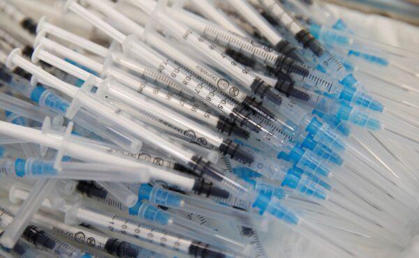 Syringes with the Pfizer-BioNTech vaccines lie on a tray during a program without an appointment, in Sant Vicenc de Castellet, north of Barcelona, Spain, on July 6, 2021. (Albert Gea/Reuters)