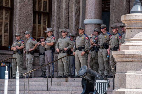 Police look on as a protest takes place outside the Texas state capitol in Austin, Texas, on May 29, 2021. (Sergio Flores/Getty Images)