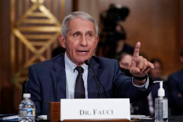 Dr. Anthony Fauci responds to accusations by Sen. Rand Paul (R-Ky.) as he testifies before the Senate Health, Education, Labor, and Pensions Committee, on Capitol Hill in Washington on July 20, 2021. (J. Scott Applewhite-Pool/Getty Images)