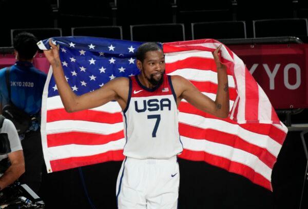 The United States' Kevin Durant celebrates after their win in the men's basketball gold medal game against France at the 2020 Summer Olympics in Saitama, Japan, on Aug. 7, 2021. (Luca Bruno/AP Photo)