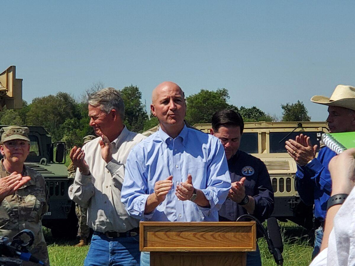 Nebraska Gov. Pete Ricketts speaks at a press conference on the border situation while other governors look on, in Mission, Texas, on Oct. 6, 2021. (Marina Fatina/NTD)