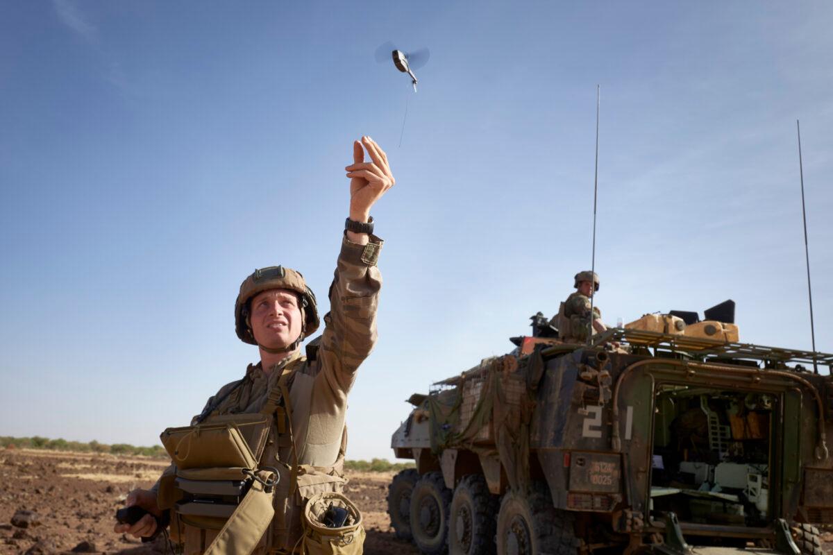 A soldier of the French Army launches a mini-drone used to check the presence of jihadist groups in northern Burkina Faso, on Nov. 11, 2019. (Michele Cattani/AFP via Getty Images)
