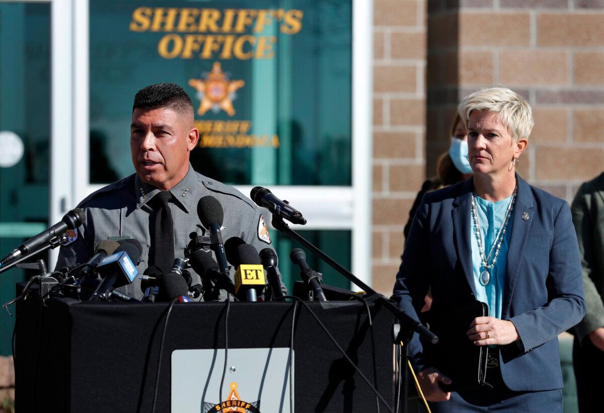 Santa Fe County Sheriff Adan Mendoza (L) speaks as Santa Fe District Attorney Mary Carmack-Altwies (R) listens during a press conference in Santa Fe, N.M., on Oct. 27, 2021. (Andres Leighton/AP Photo)