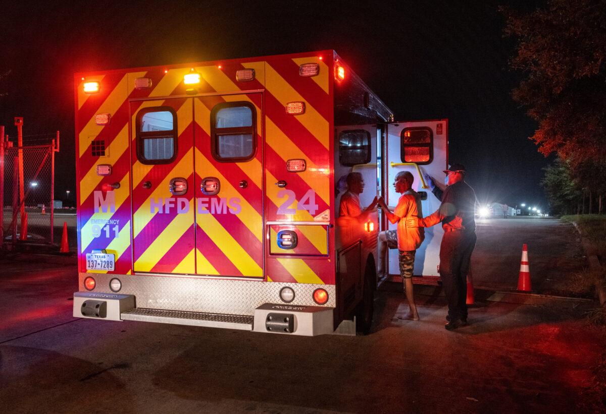 Fire Department paramedics prepare to transport a man to a hospital in Houston, Texas, on Sept. 15, 2021 in Houston. (John Moore/Getty Images)