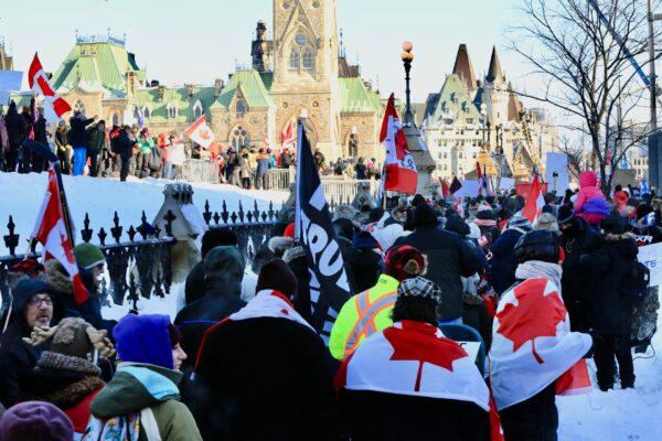 Protesters participating in the truck convoy protest against COVID-19 mandates and restrictions gather on Parliament Hill in Ottawa on Jan. 29, 2022. (Jonathan Ren/The Epoch Times)