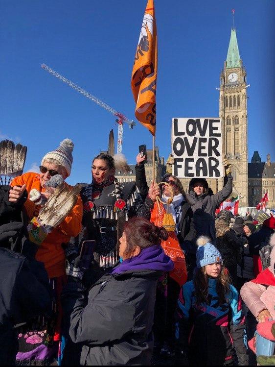 Protesters participating in the truck convoy protest against COVID-19 mandates and restrictions gather on Parliament Hill in Ottawa on Jan. 29, 2022. (Noé Chartier/The Epoch Times)