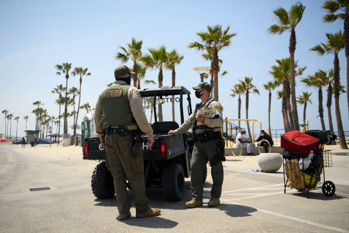 Los Angeles Sheriff's Department deputies patrol Venice Beach in Los Angeles on June 16, 2021. (Patrick T. Fallon/AFP via Getty Images)