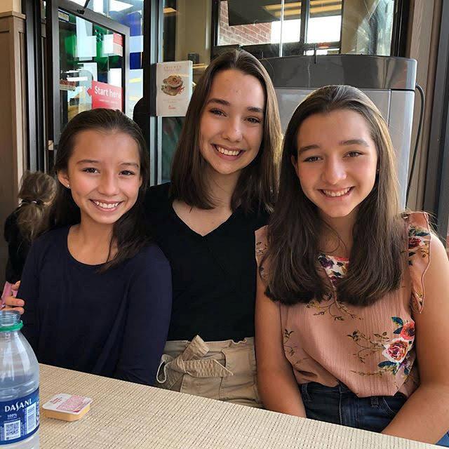 [L-R] Lorennah, Katrinnah, and Mariannah at a coffee shop in Washington, D.C. (SWNS)