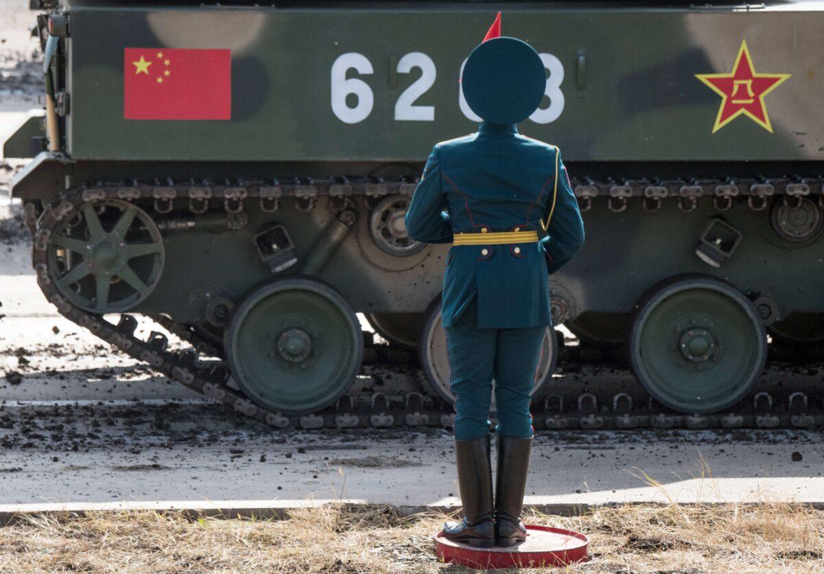 <br/>A Russian honor guard attends a parade of the participants of the Vostok-2018 (East-2018) military drills at Tsugol training ground not far from the borders with China and Mongolia in Siberia, on September 13, 2018. (Mladen Antonov/AFP via Getty Images)