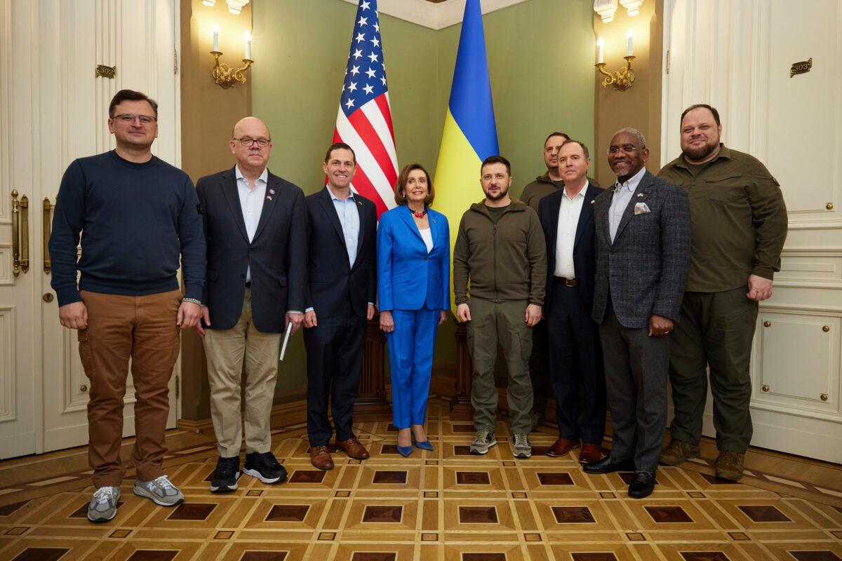Ukrainian President Volodymyr Zelenskyy (center right) and U.S. Speaker of the House Nancy Pelosi pose for a picture with members of their entourage, including Ukrainian Foreign Minister Dmytro Kuleba (L) during their meeting in Kyiv, Ukraine, on April 30, 2022. (Ukrainian Presidential Press Office via AP)