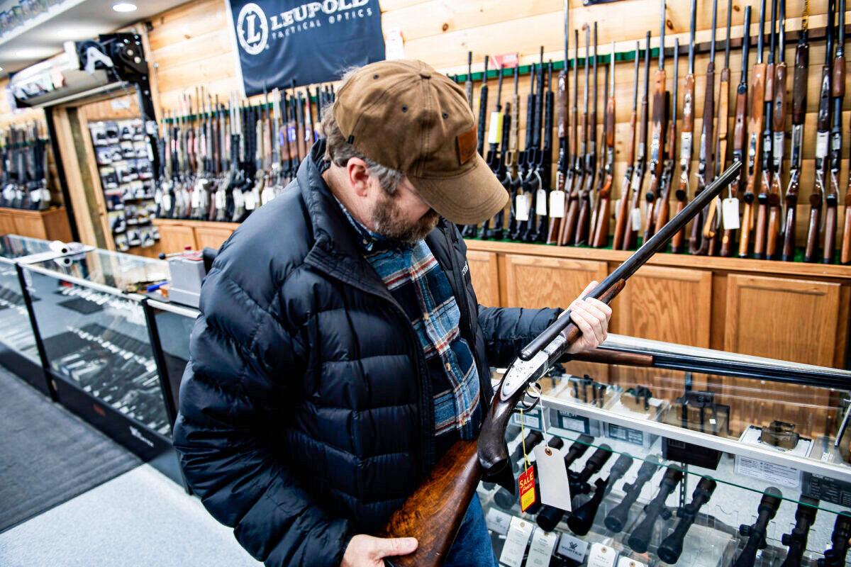 A customer looks at a firearm in a gun shop in Ohio in this file image. (Brendan Smialowski/AFP via Getty Images)