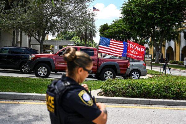 Supporters of former U.S. President Donald Trump drive around the Paul G. Rogers Federal Building & Courthouse as the court holds a hearing to determine if the affidavit used by the FBI, as justification for the raid of Trump's Mar-a-Lago estate, should be unsealed, in West Palm Beach, Fla., on Aug. 18, 2022. (Chandan Khanna/AFP via Getty Images)