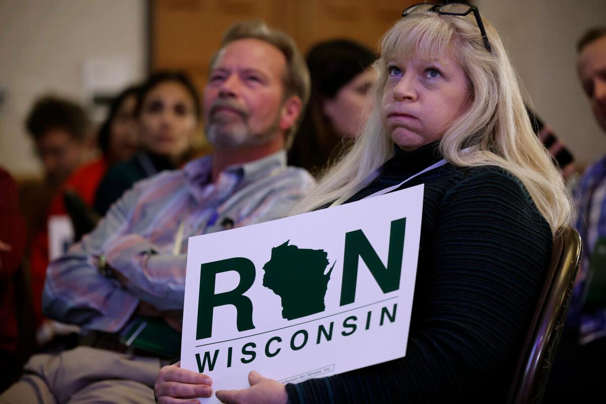 Supporters of Sen. Ron Johnson (R-WI) watch election returns during an election night party at the Best Western Premier Bridgewood Resort in Neenah, Wisconsin, on Nov. 08, 2022. (Chip Somodevilla/Getty Images)