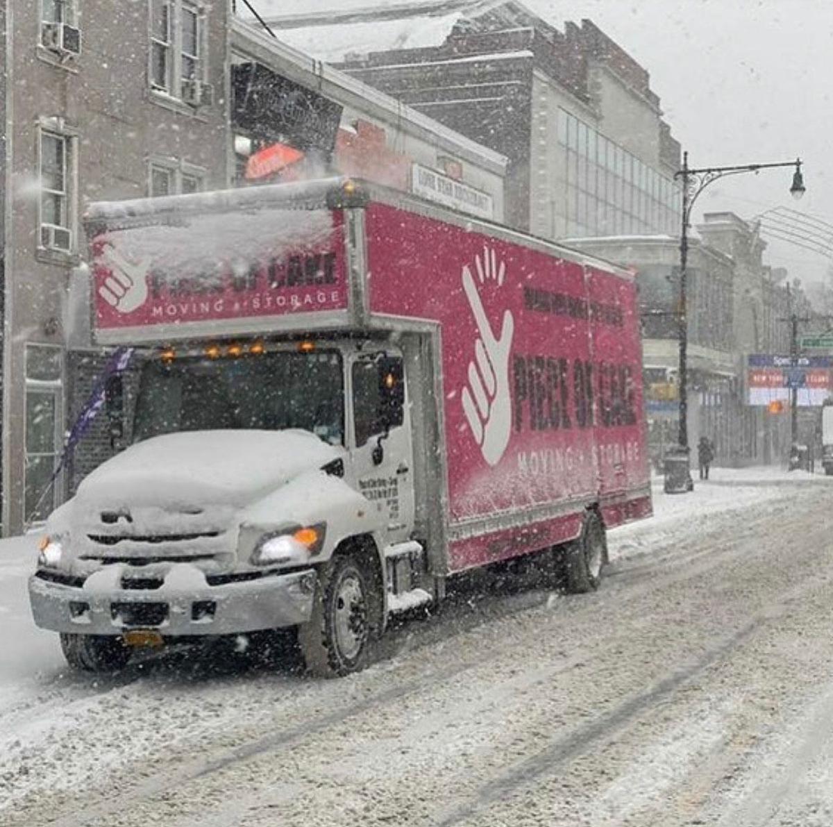 A moving van at work in New York City in the snow. (Courtesy of Piece of Cake Moving & Storage, NY)