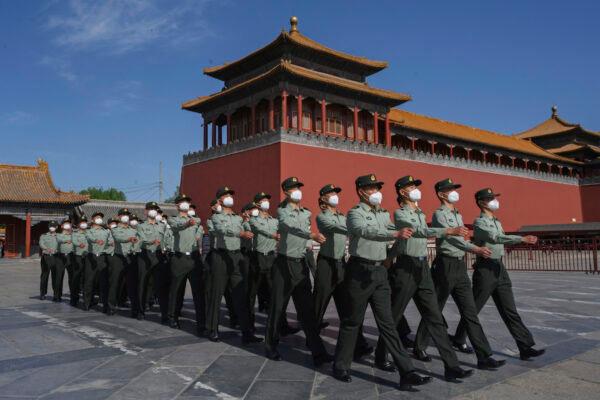 Soldiers of the People's Liberation Army's Honour Guard Battalion march outside the Forbidden City, near Tiananmen Square in Beijing on May 20, 2020. (Kevin Frayer/Getty Images)