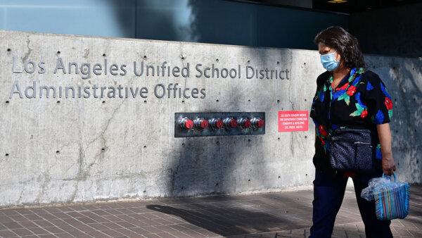 A pedestrian walks past the headquarters of the Los Angeles Unified School District in Los Angeles on October 3, 2022. (Frederic J. Brown/AFP via Getty Images)