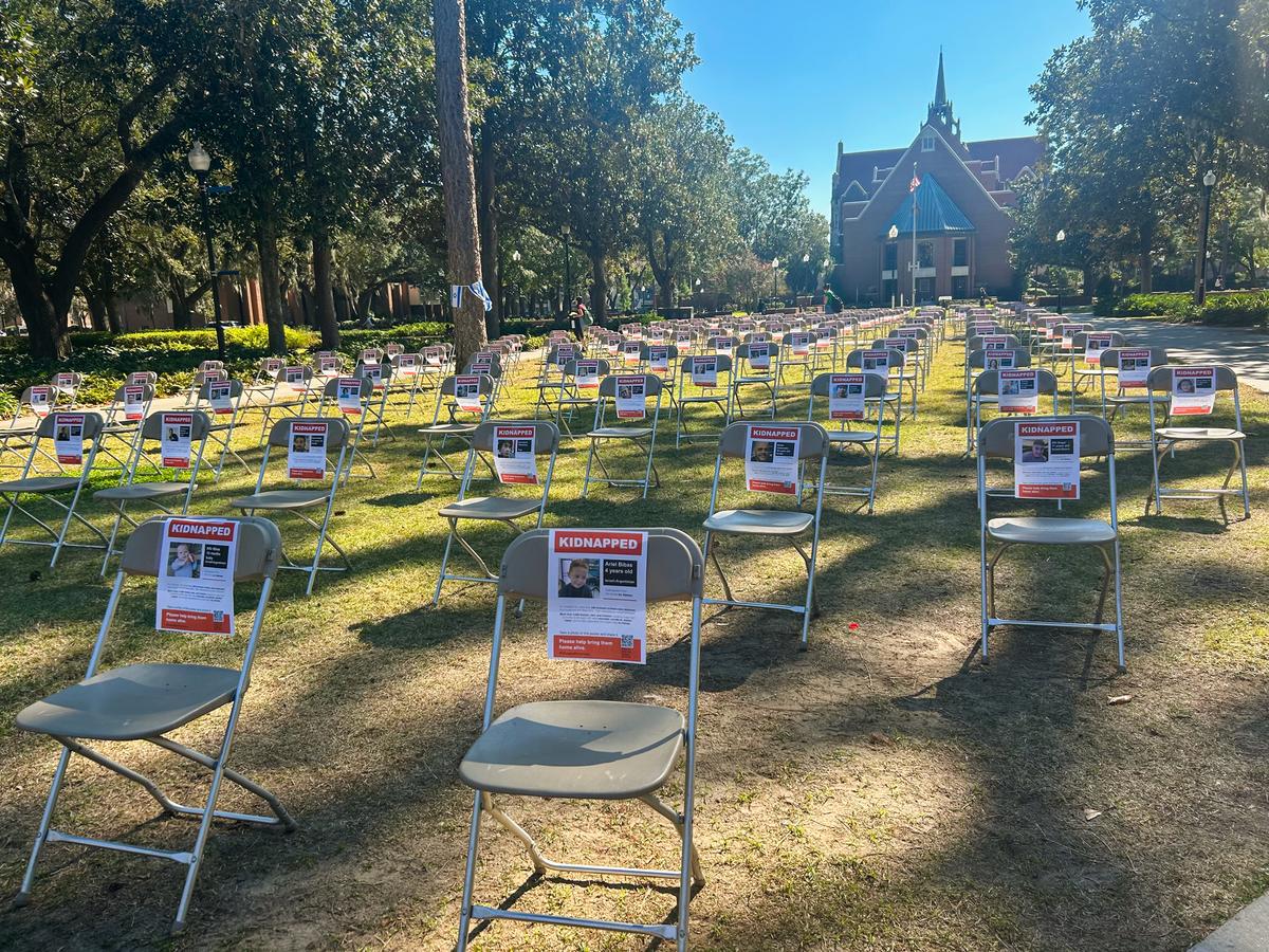 <span data-sheets-root="1" data-sheets-value="{"1":2,"2":"Chairs, one for each Hamas hostage taken from Israel, line the Plaza of the Americas courtyard at the University of Florida in Gainesville on Nov. 7, 2023. (Natasha Holt for The Epoch Times)"}" data-sheets-userformat="{"2":771,"3":{"1":0},"4":{"1":2,"2":65535},"11":4,"12":0}">Chairs, one for each hostage that Hamas terrorists had taken from Israel, line the Plaza of the Americas courtyard at the University of Florida in Gainesville on Nov. 7, 2023. (Natasha Holt for The Epoch Times)</span>