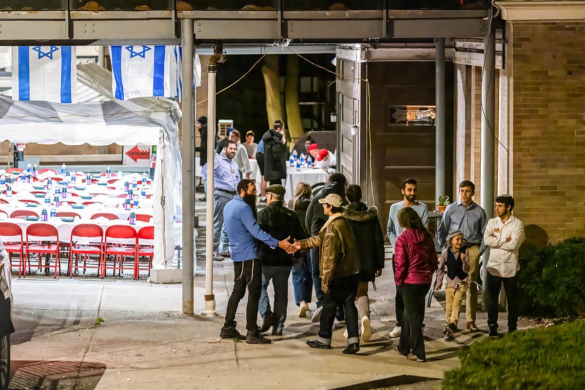 <span data-sheets-root="1" data-sheets-value="{"1":2,"2":"People greet each other at the entrance of the Center for Jewish Living at Cornell University where a Unity Shabbat dinner was held in Ithaca, N.Y., on Nov. 3, 2023. The university canceled classes after a student was accused of making violent anti-Semitic threats. (Matt Burkhartt/Getty Images)"}" data-sheets-userformat="{"2":771,"3":{"1":0},"4":{"1":2,"2":65535},"11":4,"12":0}">People greet each other at the entrance of the Center for Jewish Living at Cornell University, where a Unity Shabbat dinner was held, in Ithaca, N.Y., on Nov. 3, 2023. The university canceled classes after a student was accused of making violent anti-Semitic threats. (Matt Burkhartt/Getty Images)</span>