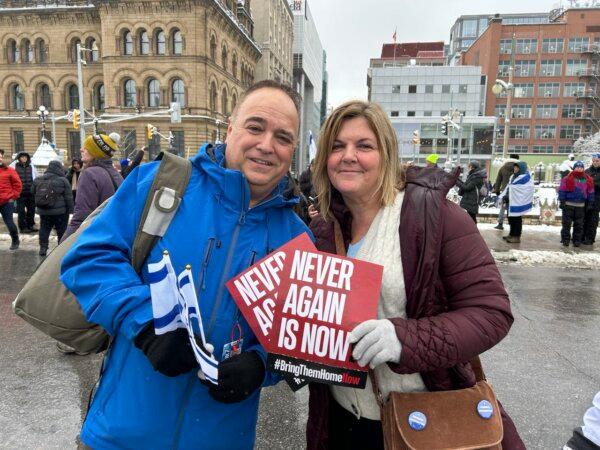 Brian Dias and his wife Heather attend the rally on Parliament Hill in Ottawa on Dec. 4, 2023.  (Donna Ho/The Epoch Times)